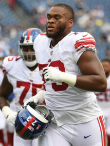 giants to re sign ot evan neal